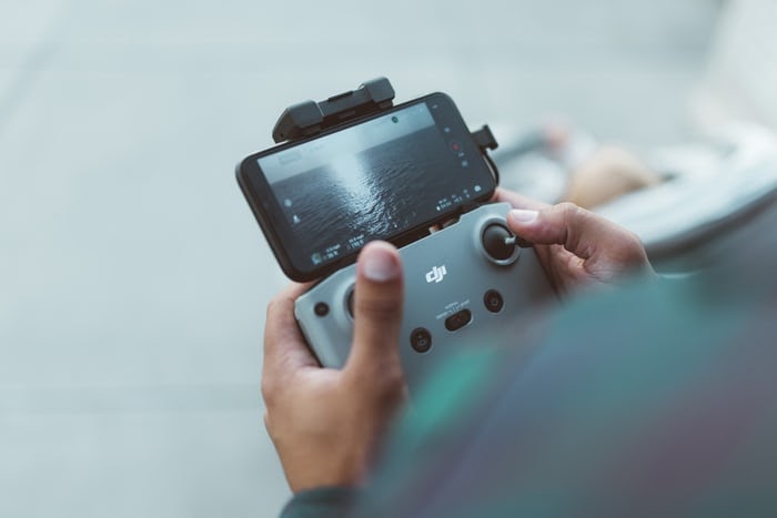 man choosing camera drone after testing functionality